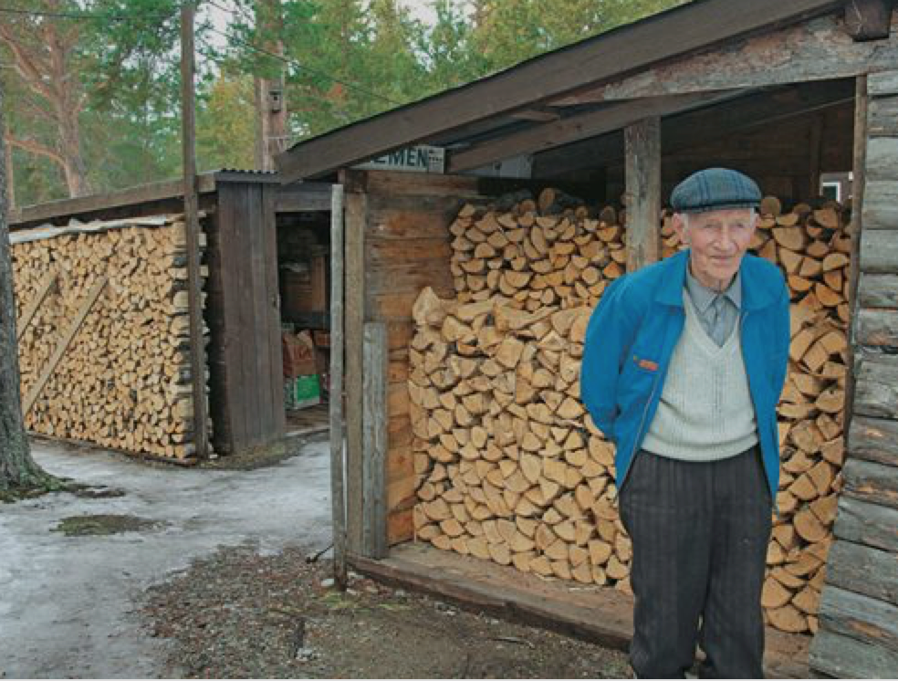 12 days Norwegian Wood man in front of stack