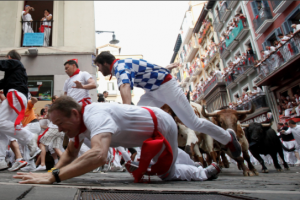 Running of Bull men fown on pavement