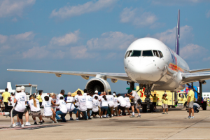 Dulles Plane Pull long ling of guys