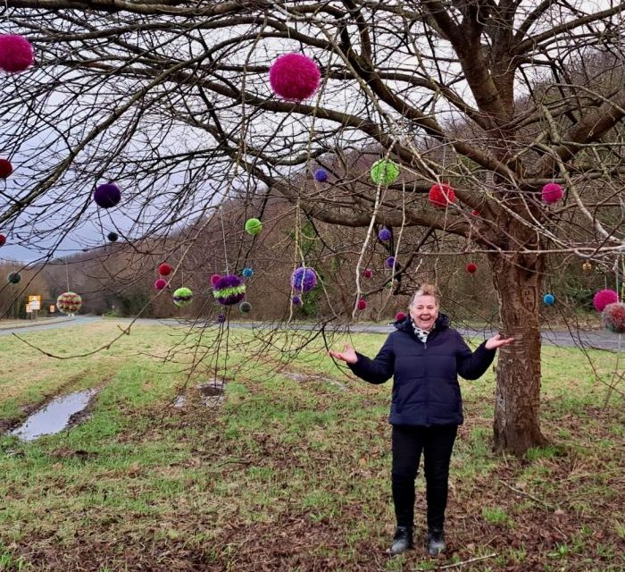 Yarnbomber bombs lonely tree with 51 Christmas baubles (balls)