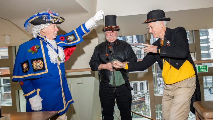 The Dull Men’s Club UK branch met on Sunday. Roy Palmer, a town crier, takes on St.John Burkett in a conker game overseen by James Packer, chairman of the World Conker Championships
