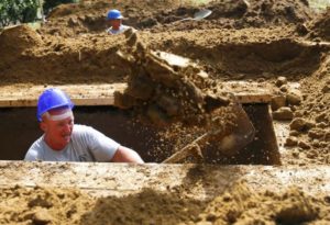 A gravedigger takes part in the first Hungarian grave digging championship in Debrecen, Hungary, June 3, 2016, competing for the national crown, which is awarded based on accuracy, speed, and aesthetic quality. REUTERS/Laszlo Balogh