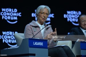 read of International Monetary Fund holding her adding machine